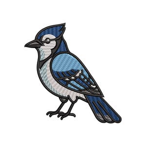 May include: Embroidered image of a blue jay bird with a detailed design. The bird features shades of blue, gray, and white, with black outlines. The bird is depicted in a side profile, showcasing its feathers and beak.