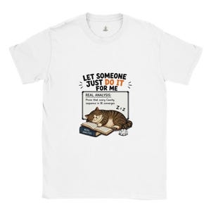 May include: A white short-sleeve t-shirt featuring a graphic of a brown tabby cat sleeping on a book titled Real Analysis. Above the cat, text reads Let someone just do it for me. A whiteboard behind the cat displays the text Real Analysis: Prove that every Cauchy sequence in IR converges.