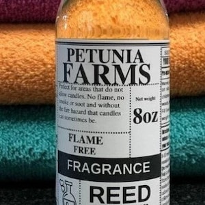 May include: A clear glass bottle with a white label that reads "Petunia Farms Flame Free Fragrance Reed Diffuser Oil" and "Net weight 8oz".