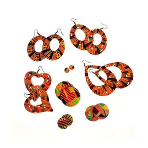 May include: A set of colorful, patterned earrings in various shapes, including circles, teardrops, and hearts. The earrings are made of wood and have a bright orange, yellow, and green color scheme.