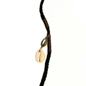 May include: A black cord necklace with a gold metal accent and a white cowrie shell pendant.