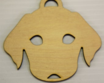 May include: Unfinished wooden dog ornament with a hole at the top for hanging. The ornament is shaped like a dog's head with cutouts for eyes and a nose.