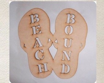 May include: Wooden cutout of two flip flops with the words "Beach Bound" spelled out on them.