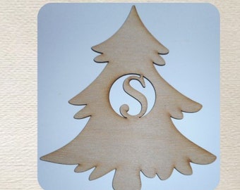 May include: Wooden Christmas tree ornament with a cut-out circle in the center and the letter "S" inside. The ornament is light brown and has a rustic look.