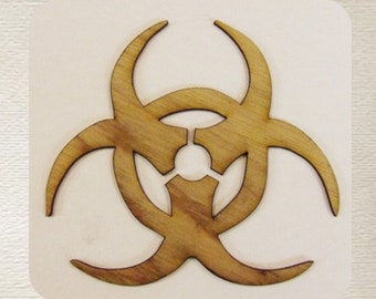 May include: A wooden biohazard symbol cut out in the shape of a three-pointed star. The symbol is brown and has a grain pattern.