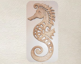 May include: A wooden cutout of a seahorse with intricate details. The seahorse is brown and has a curled tail. The cutout is on a white background.