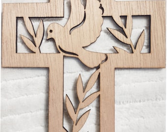 May include: Wooden cross with a dove and olive branch cut-out design. The cross is made of light brown wood and has a simple, elegant style. The dove is in flight, and the olive branches are on either side.