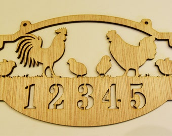 May include: Wooden sign with a rooster and chickens cut out design. The sign has the numbers 12345 cut out below the animals.