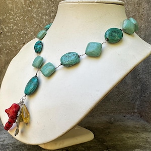 Turquoise Polished Howlite Nuggets on Chain w 4 Dangling Charms Necklace - Coral Branch, Metal Fish, Two Glass Beads - Toggle Closure