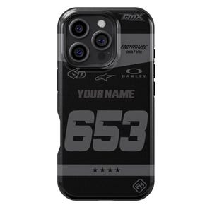 May include: Black phone case with a racing-inspired design. Features the text "FASTHOUSE SPEED / STYLE", "YOURNAME", and the number "653". Includes the Oakley and Star D logos, and a four-star graphic.
