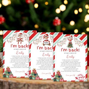 May include: Three rectangular Christmas cards with red and green diagonal striped borders. Each card features an illustration of an elf, a pile of gifts, and the text I'm back and ready for adventure with Emily, followed by a letter signed Love, your Elf.