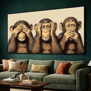 May include: A rectangular wall art print featuring a detailed illustration of three chimpanzees in the classic see no evil, hear no evil, and speak no evil pose. The monkeys are rendered in shades of brown and black against a light cream background.
