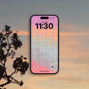 May include: A smartphone displaying a lock screen with a digital clock showing 11:30 and the date Thu Aug 6. The wallpaper features a repeating pattern of small book icons over a soft, gradient background transitioning from pink to light blue.