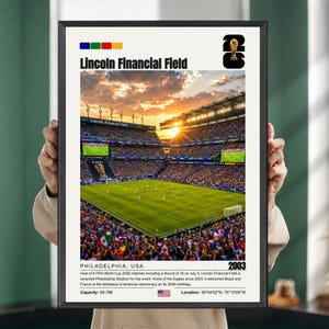 May include: A framed poster featuring a sunset view of Lincoln Financial Field in Philadelphia, USA. The image shows a soccer match with a FIFA World Cup 2026 logo, the text 'Lincoln Financial Field', 'Philadelphia, USA', and '2003', plus capacity and location data.