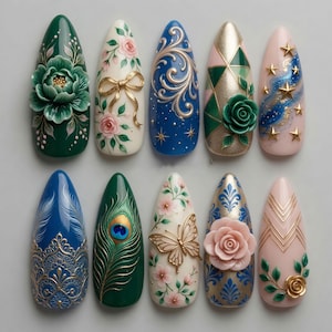 May include: A set of ten almond-shaped press-on nails featuring intricate 3D designs, including sculpted flowers, gold bows, butterflies, peacock feathers, lace patterns, geometric gold lines, and celestial star motifs in a palette of green, blue, pink, and gold.