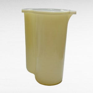 May include: A cream-colored plastic pitcher with a wide mouth and a handle. The pitcher has a smooth, rounded shape.