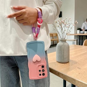 Funda con correa de muñeca ondulada degradada para Samsung Galaxy S26 S25 S24 Ultra