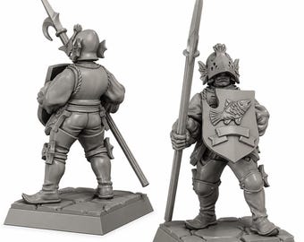 May include: Two grey unpainted miniature figurines of a knight standing on a stone-textured base. The knight wears a helmet with fin-like side details, holds a long spear, and carries a shield featuring a raised relief of a fish and a blank banner.