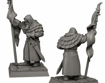 May include: Two gray miniature figurines of a robed figure holding a flag and a sword. The figure is standing on a square base. The figure has a hood and a long beard. The flag is draped over a pole.