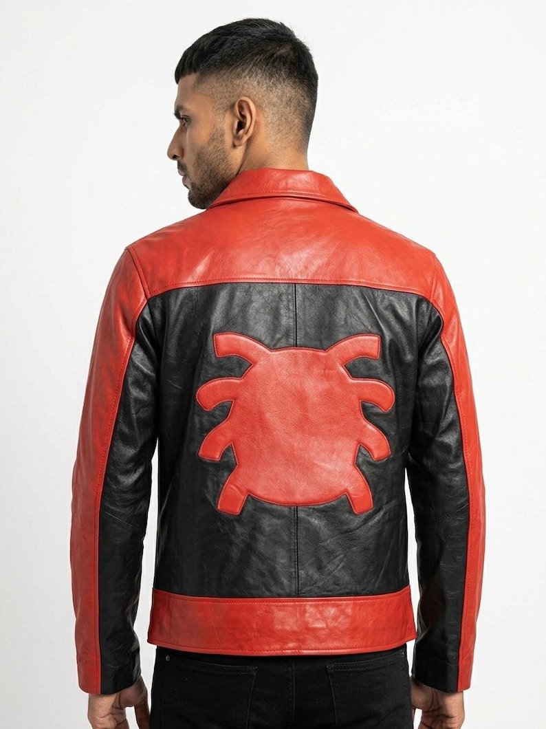 May include: A red and black leather jacket with a unique design on the back. The jacket features a red collar, shoulders, and hem, with black panels and a red emblem. The jacket is a stylish outerwear piece.
