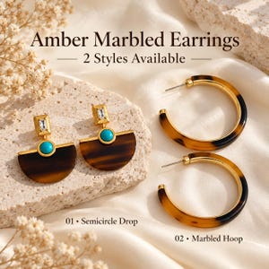 May include: Amber marbled earrings in two styles. Style 01 features a semicircle drop with a turquoise stone and a rectangular crystal. Style 02 features a marbled hoop. Text reads: Amber Marbled Earrings, 2 Styles Available.