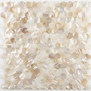 May include: A mosaic tile sheet composed of numerous hexagonal tiles. The tiles have a pearlescent finish with a mix of white, cream, and tan hues. The overall effect is a shimmering, textured surface suitable for various design applications.