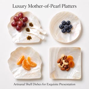 May include: Four mother-of-pearl platters with iridescent surfaces. One shell-shaped dish holds red grapes and two small spoons with caviar. A round dish holds blueberries. Another shell-shaped dish holds orange slices. A square dish holds mixed nuts.