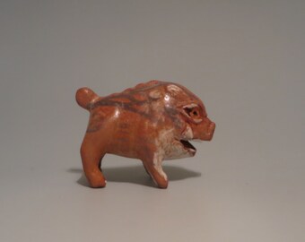 Hand carved ceramic boar figurine
