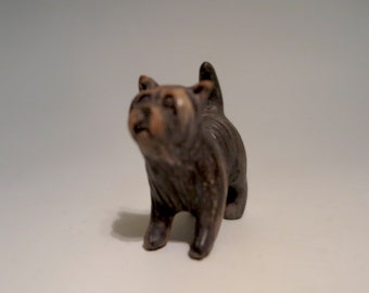 Hand carved pit fired ceramic sculpture of a Yorkshire Terrier