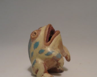 Hand carved spotted ceramic frog