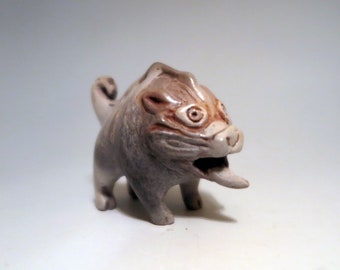 Hand carved pit fired ceramic sculpture of a pig or boar