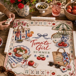 May include: A decorative Mahjong game set with a "Tomato Girl Summer" theme. The game board features illustrations of tomatoes, cocktails, and beach bags. The set includes tiles, a basket of tomatoes, and a straw hat.