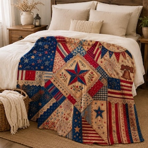May include: A patriotic quilt featuring a patchwork design with red, white, and blue stars, stripes, and floral patterns. The quilt has a large central star and a bell illustration, perfect for a bedroom or living room.