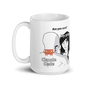 May include: White ceramic mug with a black and white cartoon illustration. The mug features the text "Are you sure? My project Claude Code" with a pixelated graphic. The mug has a white handle.
