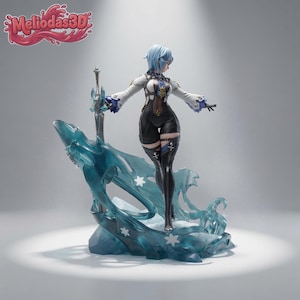 May include: A collectible figurine of a character with short blue hair, wearing a white and black outfit with blue accents. The figure stands on a translucent blue ice-themed base with snowflake details, holding a silver sword next to the Meliodas3D logo.