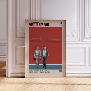 Peut inclure: Affiche encadrée du film "Ford v Ferrari" avec un fond rouge, deux voitures de course et deux hommes marchant. Le titre est en haut, avec l'année 2019 en bas. L'affiche est dans un cadre doré.