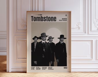 May include: A framed movie poster for the 1993 film Tombstone. The poster features a black and white photograph of four men in western attire and hats against a light beige background. Text includes the title, director, and cast names.