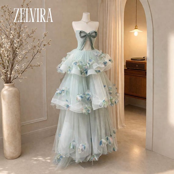 coquette prom dress The Pearled – Ella Bella RoZio crowned with a square neckline and billowing sleeves Coquette Pink Satin Bow Gown