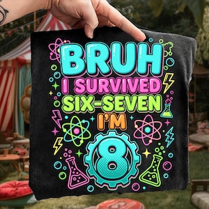 May include: Black graphic tee with the text "BRUH I SURVIVED SIX-SEVEN I'M 8". The design includes neon blue, pink, green, and orange text, along with science-themed graphics like atoms, beakers, and lightning bolts. The tee is held by a hand.