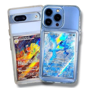 May include: Two smartphones, one light blue and one silver, each encased in clear protective cases. Each case holds a collectible trading card with Japanese text and colorful illustrations. The cards feature a fiery creature and a blue bird.
