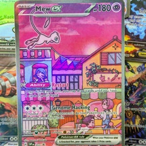 May include: A holographic Mew ex Pokémon trading card. The card features a pink Mew ex character floating above a colorful town scene. The card has the text "Restart" and "Genome Hacking" with other game instructions.