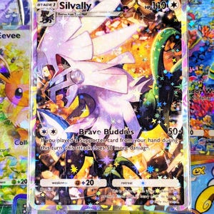 May include: A holographic Silvally EX Pokémon card. The card features a white and purple creature with a green tail, and the text "Brave Buddies". The card has a HP of 110 and a weakness of +20.