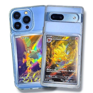 May include: Two clear phone cases with Pokemon trading cards inside. One case holds a blue phone with multiple camera lenses, and the other holds a silver phone. The cards feature colorful illustrations and Japanese text.