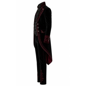 May include: Black velvet tailcoat with burgundy accents, featuring ornate embroidery and decorative buttons. The ensemble includes a matching vest and trousers, creating a gothic or Victorian-inspired look. The coat has a high collar and a chain detail.
