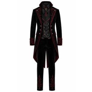 May include: A black velvet suit with red embroidered accents. The suit includes a long coat with a tail, a vest, a dress shirt, a tie, and matching pants. The coat and pants have decorative embroidery.