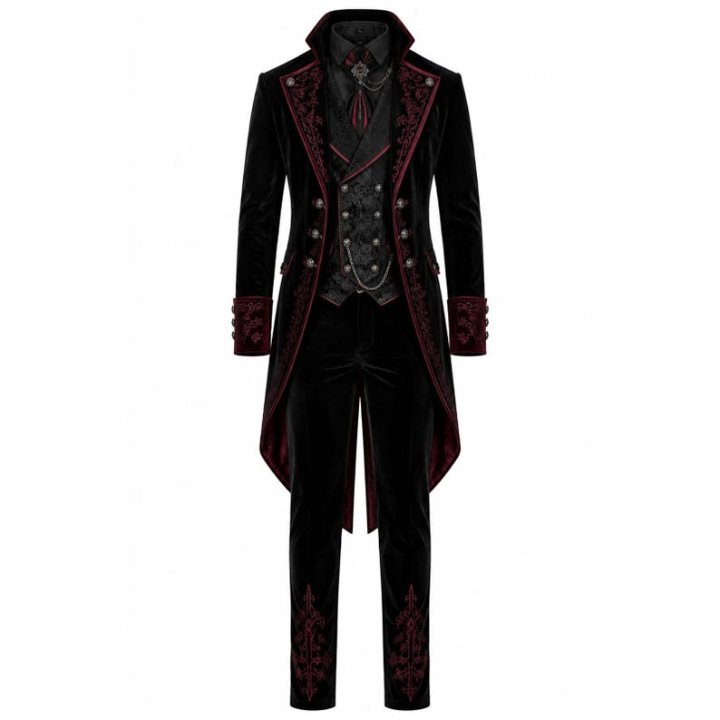 May include: A black velvet suit with red embroidered accents. The suit includes a long coat with a tail, a vest, a dress shirt, a tie, and matching pants. The coat and pants have decorative embroidery.
