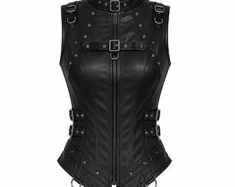 May include: A black sleeveless vest featuring a high collar with a buckle, a full-length front zipper, and multiple decorative straps with metal buckles and eyelets. The garment includes silver-toned hardware, D-rings, and vertical panel seams.