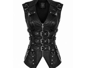 May include: A black sleeveless vest featuring a front zipper closure, three horizontal buckled straps across the midsection, silver-toned metal hardware, D-rings, and decorative chains. The garment has a high collar and a pointed hemline.