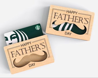 May include: Wooden gift card holder with a cutout mustache design. The holder says "Happy Father's Day".