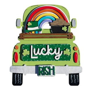 May include: Green wooden truck with a rainbow, a pot of gold, and a leprechaun hat in the bed. The truck has a license plate that says "IRISH" and a sign that says "Lucky".